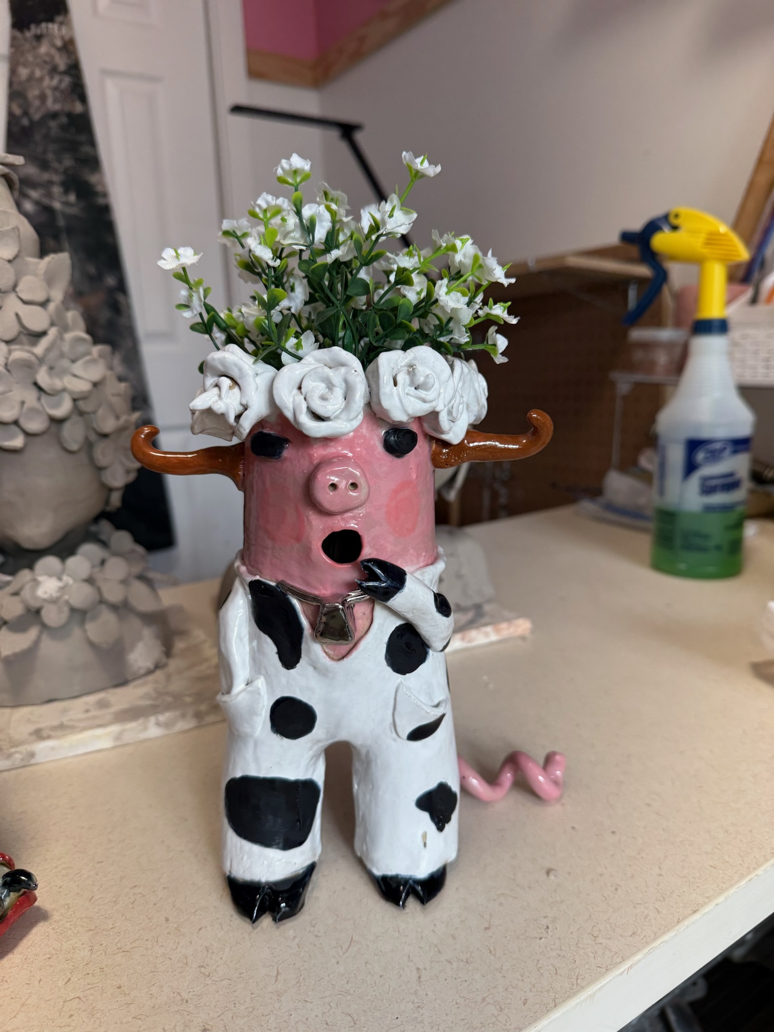 Pig-cow figurine with rose crown